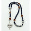 Boy’s dark blue baptism rosary with footballs and a name in beads.