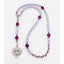 Girl’s lavender baptism with purple crystals and a name in beads.