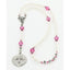 Girl’s white baptism with pink crystals and a name in beads.