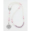 White and pink fancy girl’s baptism rosary with a name in beads.