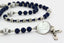 Custom men's rosary with dark blue and grey pearls, name in beads and an engraved disc.