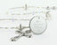 Quinceanera rosary with rystals and crystal lined pearls has an engraved disc for a girl's quinceanera gift.