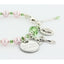 Pink pearl and green crystal rosary bracelet with an engraved disc and charms.