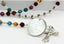 Multicolored birthstone personalized rosary with engraved disc and Grandma in beads.