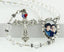 Clear birthstone and multiple color dangle custom rosary with photo centerpiece.