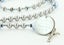 Custom grey pearl and blue crystal baptism rosary, with an engraved disc for a boy’s baptism gift.