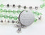 Green crystal baptism rosary with white pearls and an engraved disc, for a girl’s baptism gift.