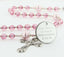 Girl's pink quinceanera rosary with an engraved disc for a girl's quinceanera gift.