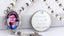 White pearl memorial car rosary beads with photo center and engraved disc.