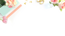 flowers and paper laying on a white table.-desktop