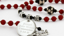 Red and black soccer communion rosary with a name in beads and engraved disc. -desktop