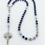 Dark Blue and light blue pearl rosary with the name Trevor in square beads. 