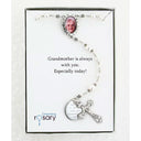 White memorial rosary with photo centerpiece and engraved disc in Charming Rosary gift box.