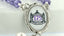 Close-up Lavender crystal rosary with photo centerpiece of Mount St. Mary Academy logo