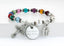 Multiple color birthstone and white pearl rosary bracelet with an engraved disc.