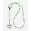 Green crystal girl’s baptism rosary with white pearls and a name in beads.