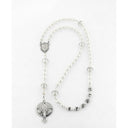 Girl’s white baptism rosary with crystal lined pearls and a name in beads.