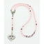 Personalized pink pearl and crystal girl’s baptism rosary with a name in beads.