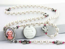White pearl and pink birthstone Angel memorial rosary beads with photo center and engraved disc.
