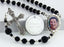 Black memorial rosary beads with photo centerpiece and engraved disc.