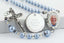 Light blue memorial rosary beads with photo centerpiece and engraved disc.