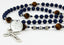 Men's rosary with dark blue and brown pearls with an engraved disc and Dad in beads.