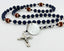 Dark blue personalized men's rosary with footballs, an engraved disc and Dad in beads. 