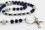 Custom men's rosary with dark blue and grey pearls, name in beads and an engraved disc. 