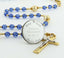 Custom gold and sapphire blue crystal Quinceañera rosary, with an engraved disc for a girl's Quinceañera gift.