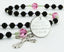 Black, pink and green quinceanera rosary with an engraved disc, for a girl’s quinceanera gift.