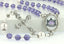 Custom lavender crystal and white pearl School rosary. With a photo centerpiece of Mount St. Mary school logo.