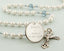 White pearl wedding rosary with light blue crystals and an engraved disc for a bridal bouquet.