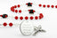 Custom Detroit hockey rosary with red and white beads and an engraved disc. 