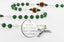 Custom East Lansing football rosary with green and white beads and an engraved disc. 