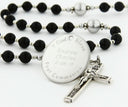 Custom black and grey first communion rosary, with an engraved disc for a boy’s communion gift.