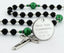 Custom black and green first communion rosary, with an engraved disc for a boy’s communion gift.