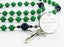 Custom green and dark blue first communion rosary, with an engraved disc for a boy’s communion gift.