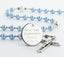 Custom light blue and white first communion rosary, with an engraved disc for a girl’s communion gift.