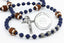 Custom dark blue first communion rosary with footballs, an engraved disc, and a name in beads. 