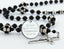 Custom black soccer first communion rosary with an engraved disc.