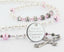 White and pink first communion rosary, with an engraved disc and name in beads for a girl’s communion gift.