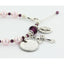 Pink pearl and purple crystal rosary bracelet with an engraved disc and charms.