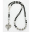 Personalized black and grey boy’s first communion rosary with a name in beads.