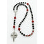 Personalized black and red boy’s first communion rosary with a name in beads.