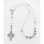 Personalized white and pink girl’s first communion rosary with a name in beads.