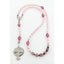 Girl’s pink first communion rosary with a name in beads.