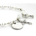 White pearl and crystal rosary bracelet with an engraved disc, cross and chalice charms. 