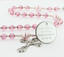 Girl's pink quinceanera rosary with an engraved disc for a girl's quinceanera gift.  