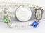 White pearl and multiple color birthstone personalized rosary with an engraved disc. 