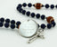 Dark blue baptism rosary with footballs and an engraved disc, for a boy’s baptism gift.